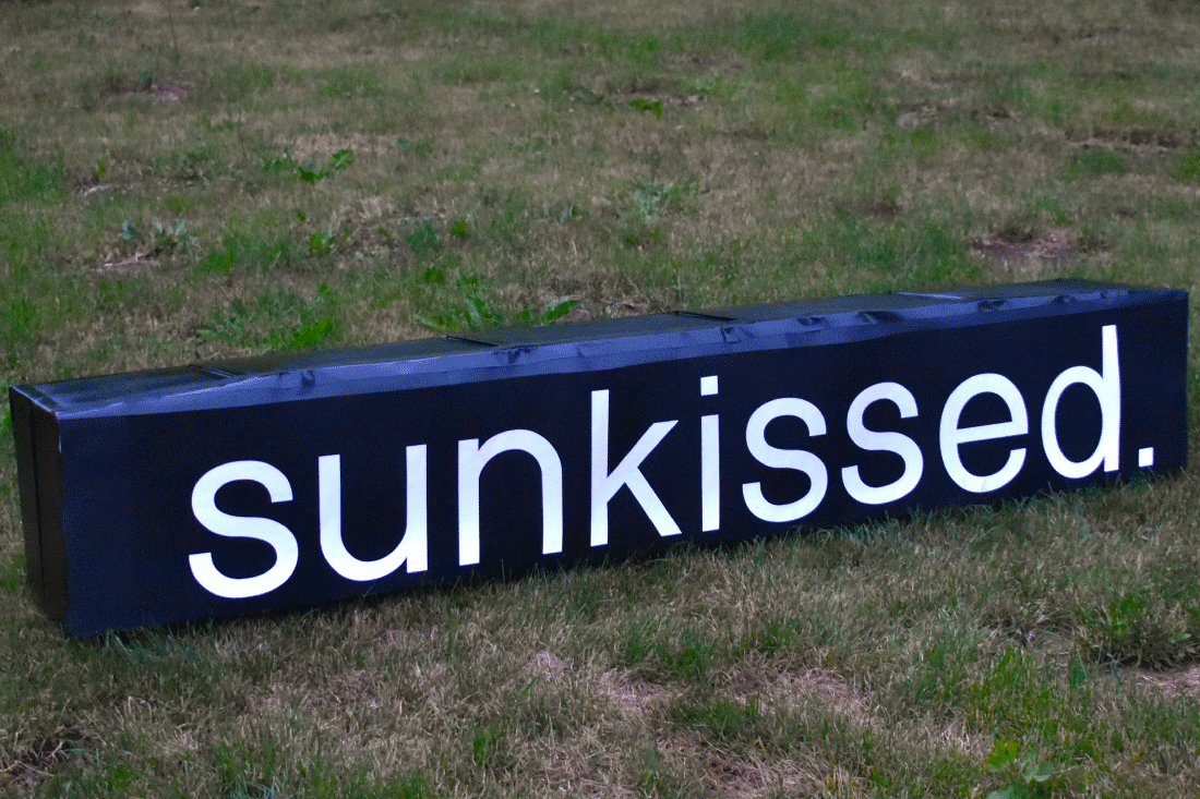 Sunkissed sign in a field