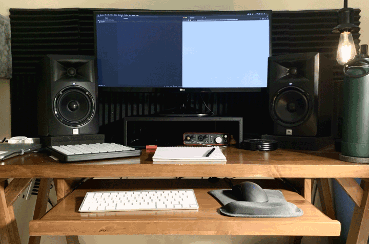 A computer setup with a text editor and browser splitting the screen in half.